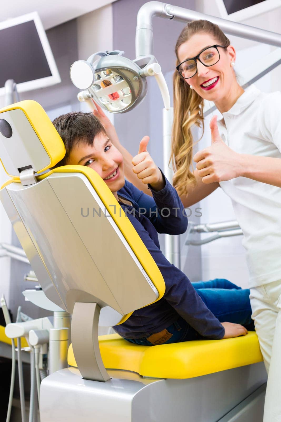 Dentist treats patient in dental practice