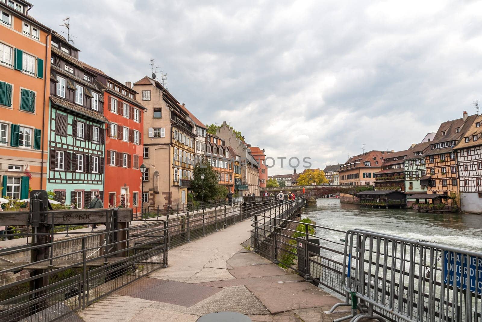 Strasbourg, water canal in Petite France area. timbered multicolored houses and trees in Grand Ile. Alsace, France.