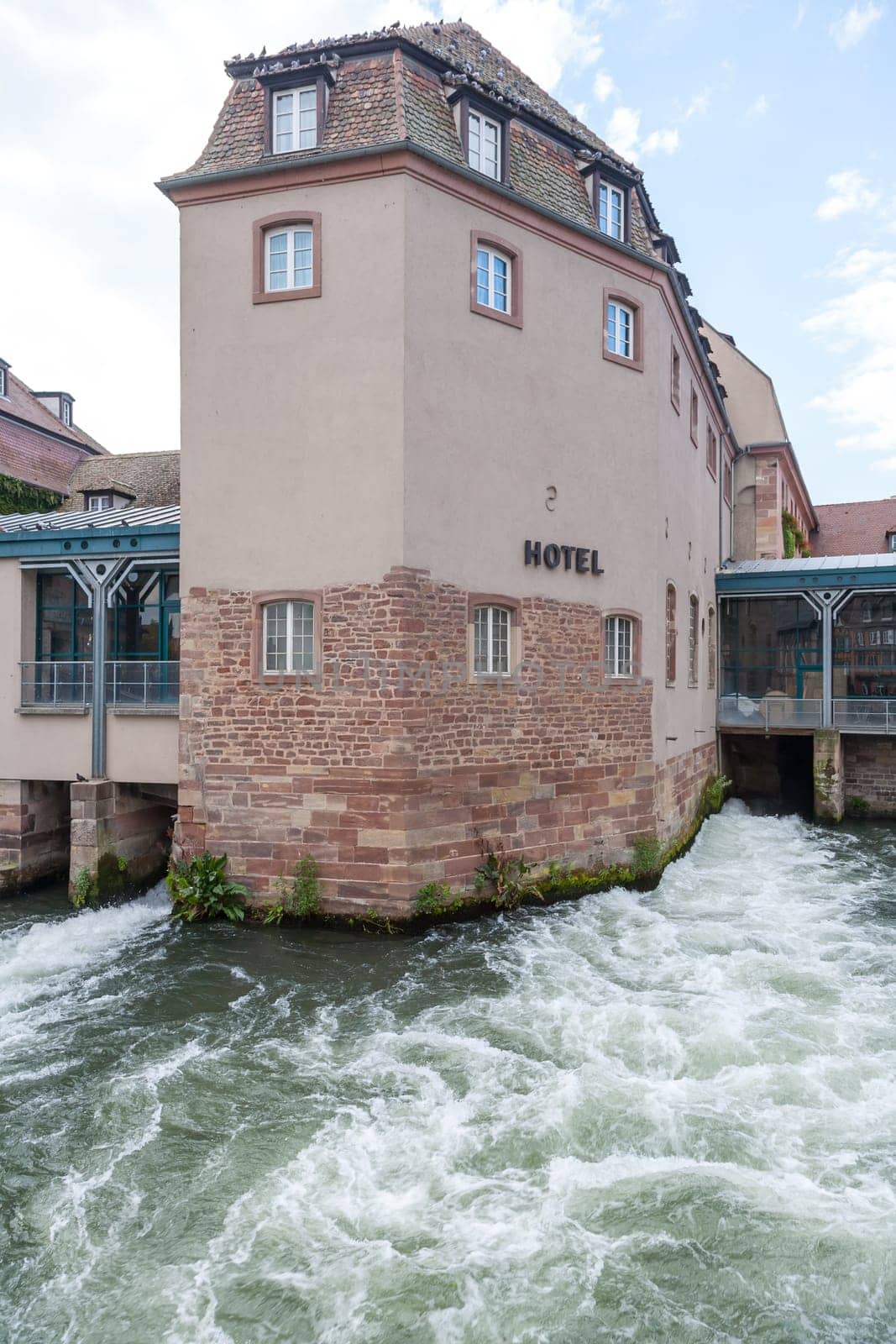 Strasbourg, water canal in Petite France area. timbered houses and trees in Grand Ile. Alsace, France.