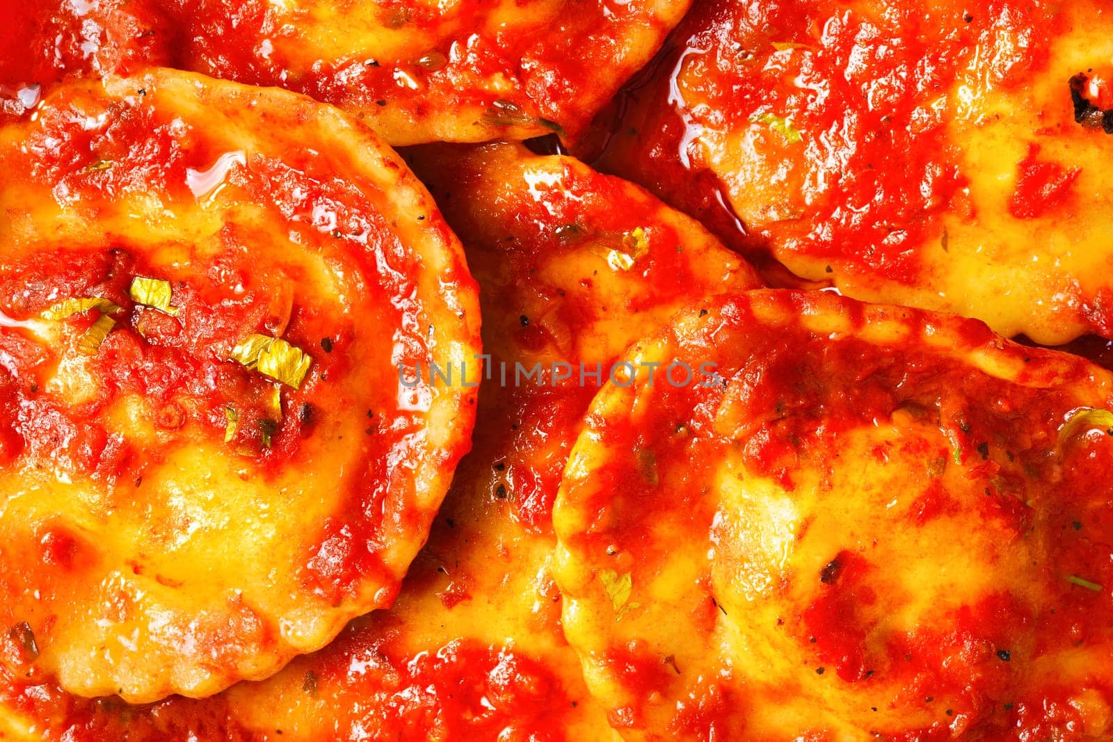 italian ravioli in tomato sauce food background