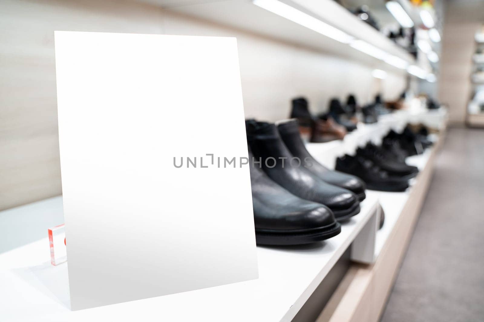 perspective view of point of sale empty shelf sign poster holder mockup in retail shoe store window