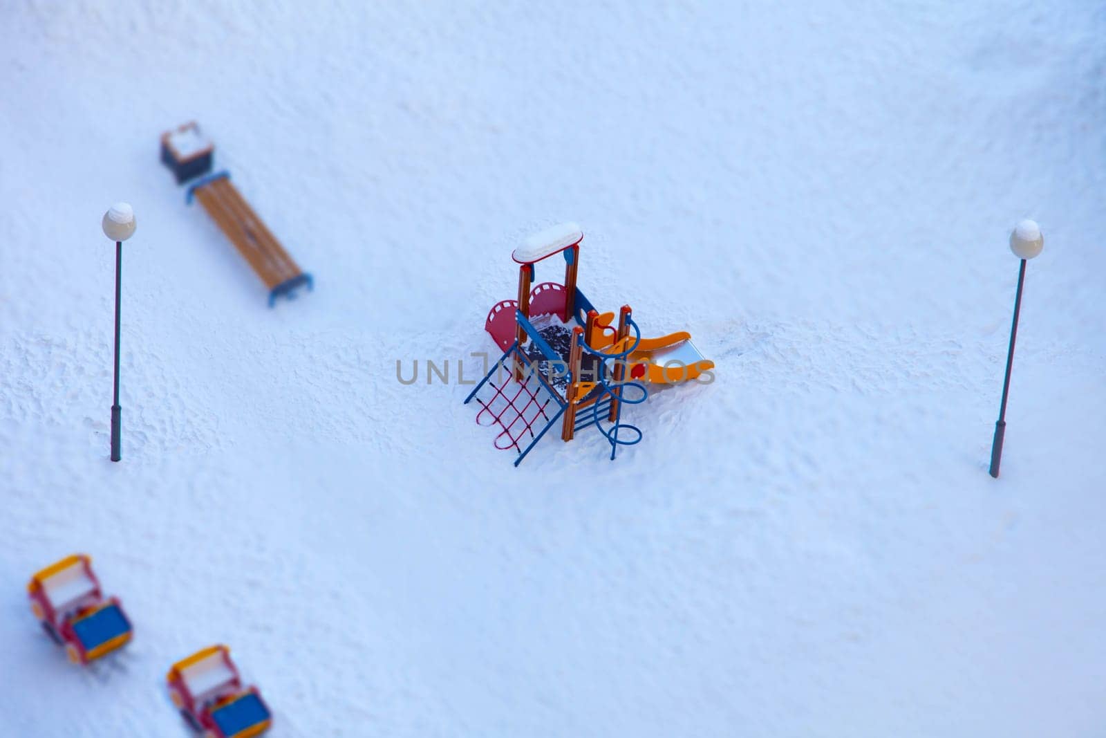 children's playground empty winter aerial view, tilt shift