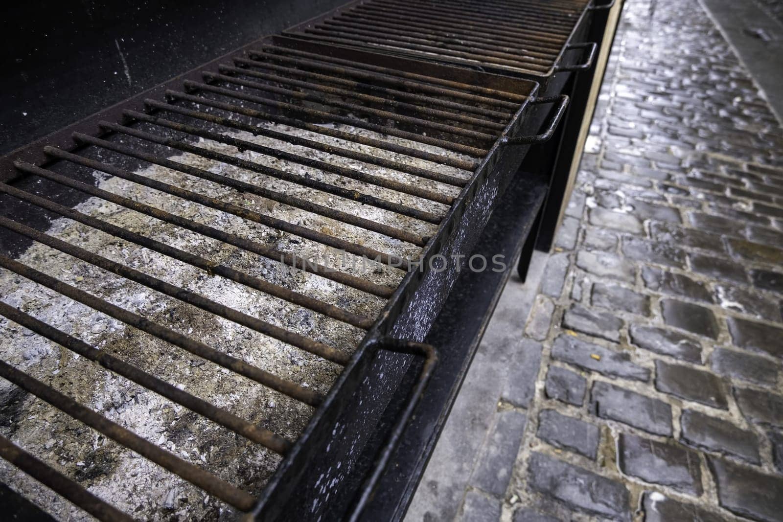 Detail of old abandoned metal grill, grill meat on the street
