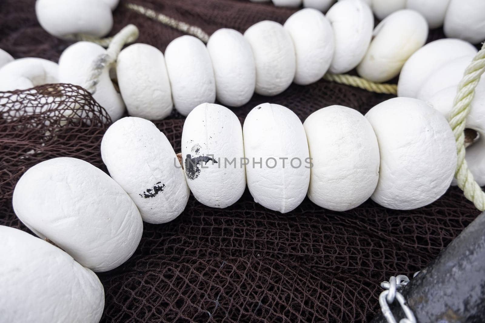 Detail of old deep sea fishing nets on a commercial dock