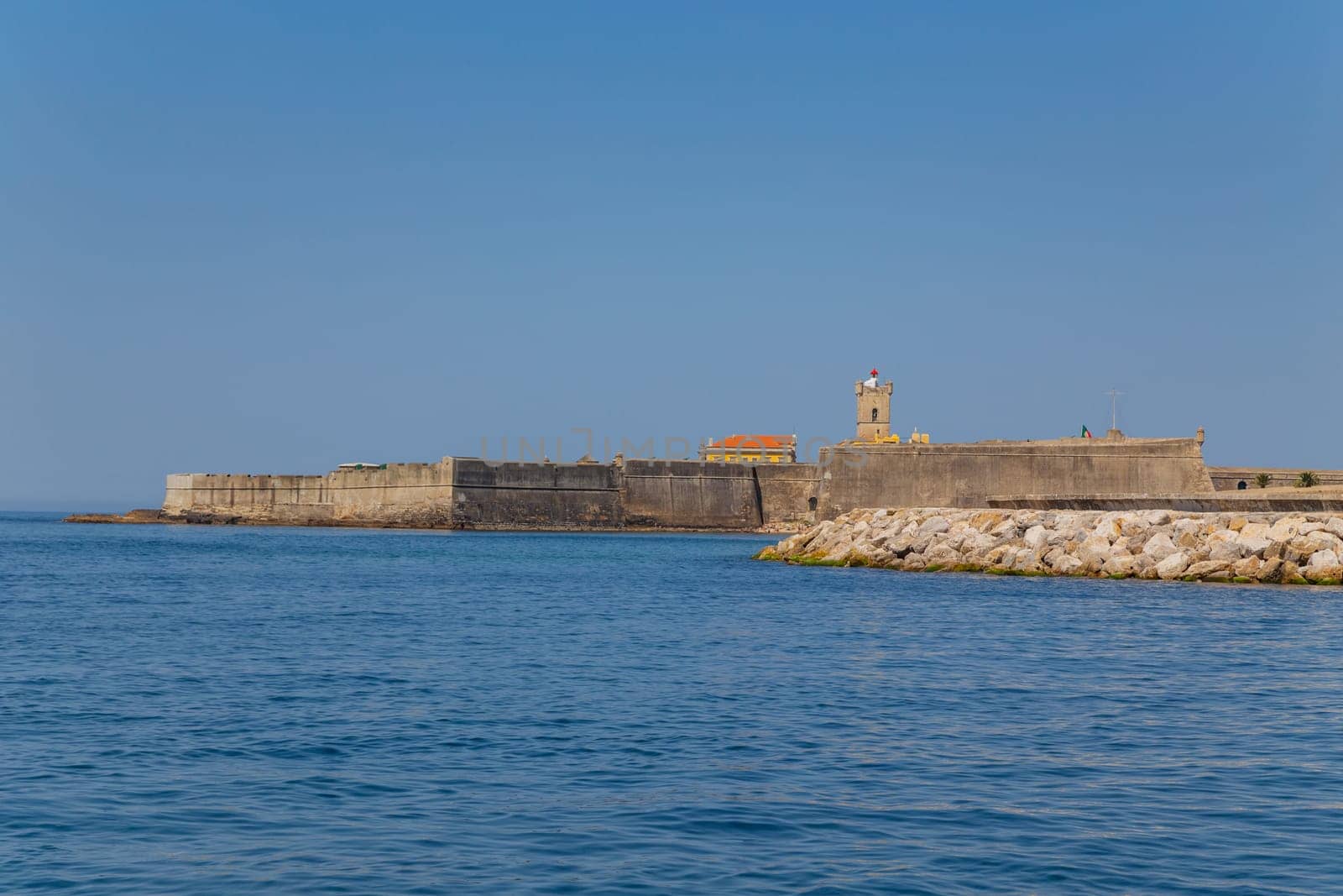 Saint Julian Fortress (Forte Sao Juliao da Barra) with lighthouse tower, beach of Carcavelos, Portugal