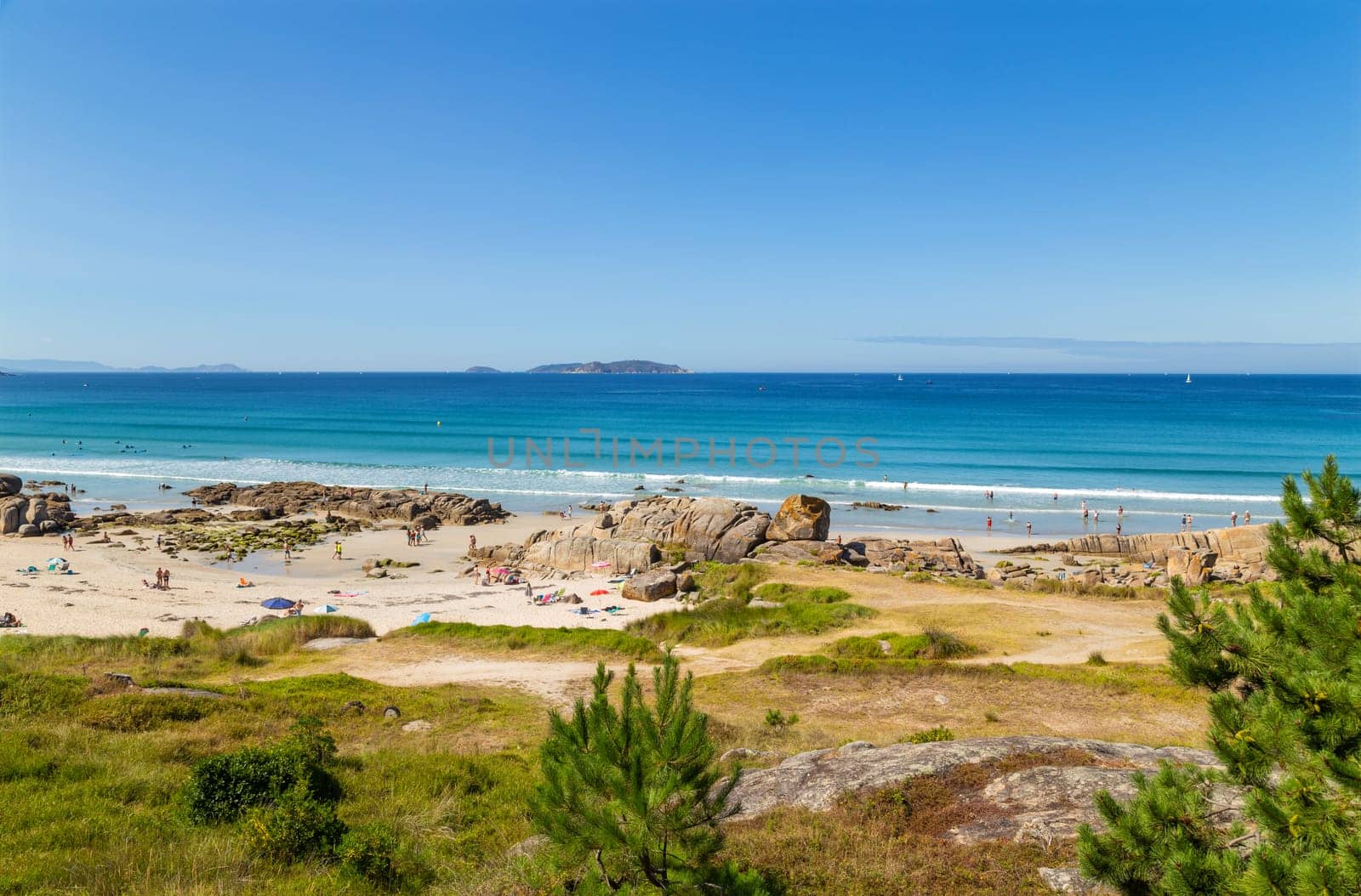 Galicia, Spain - July 27, 2022: People in Galicia beach in a summer day, Galicia. Spain