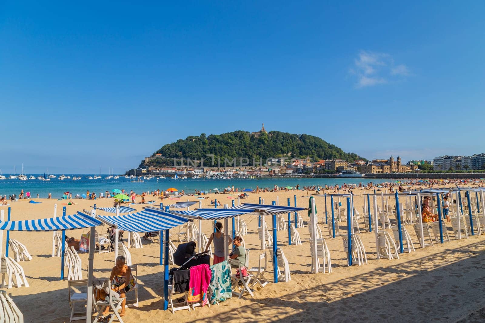 San Sebastian, Basque Country, Spain: August, 20, 2022: Landscape of La Concha beach in the city of San Sebastian, in the Spanish Basque Country