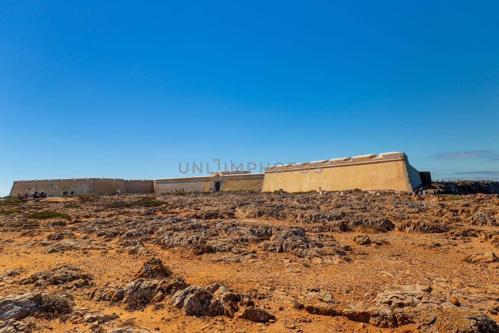 Sagres, Portugal: 2022 August 17: People walking through the Fortaleza de Sangres in the Algarve, Portugal in summer.