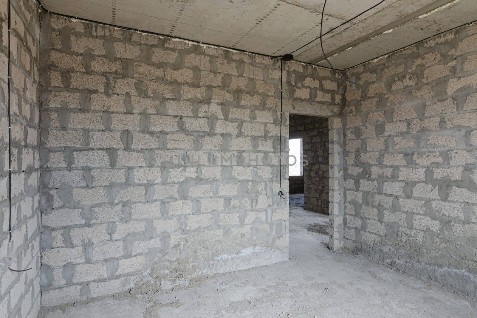 Construction of an individual residential building, view of the walls of the room, a doorway in the wall