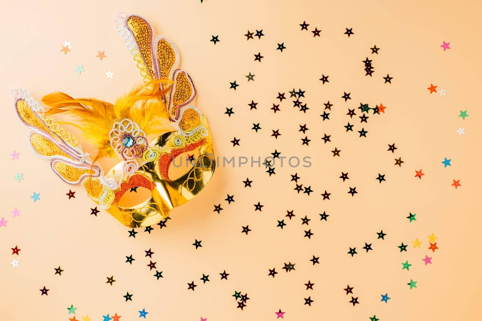 Happy Purim carnival decoration. Purim and Mardi Gras in Hebrew, Masquerade party event, celebration background banner design, Golden venetian ball mask, carnival mask isolated on pastel background