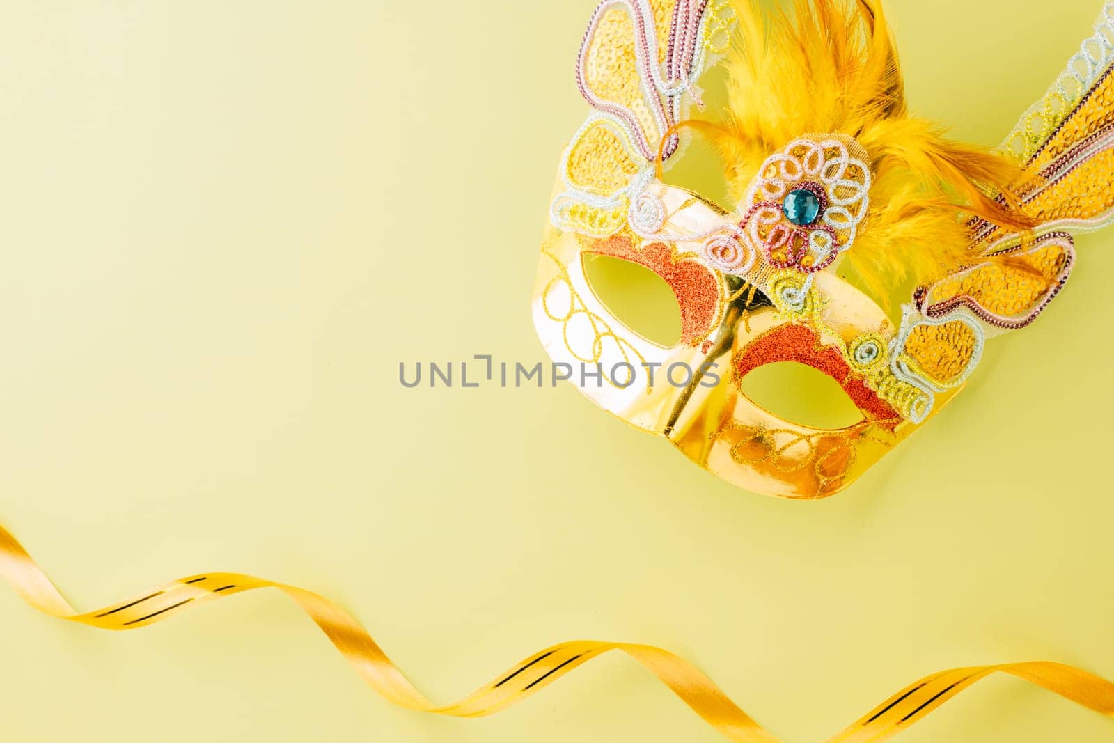 Happy Purim carnival accessories. Carnival mask for Mardi Gras celebration isolated on pastel green background, jewish holiday, Purim in Hebrew holiday carnival ball, Venetian mask