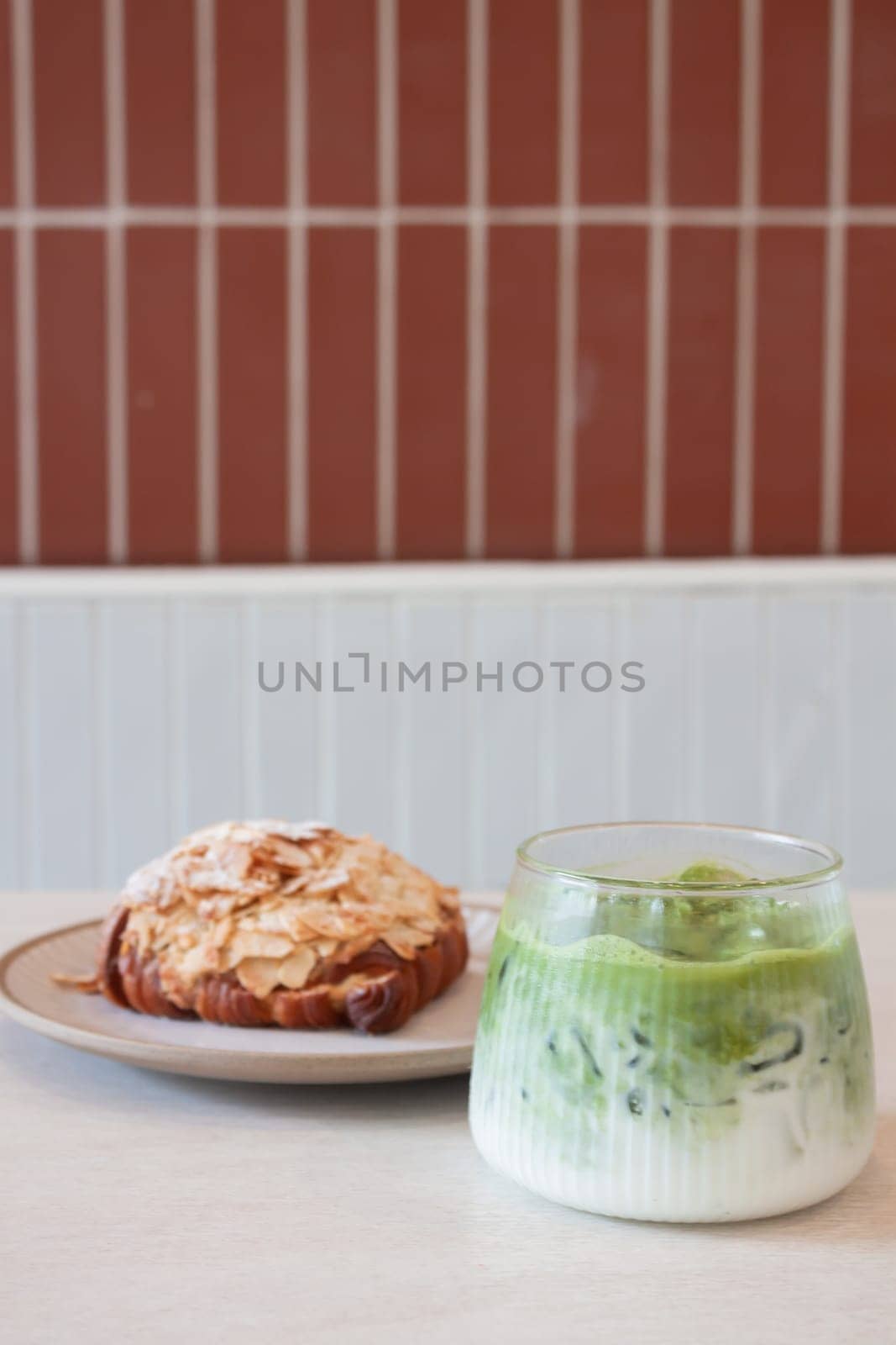 ce matcha green tea served with croissant, stock photo