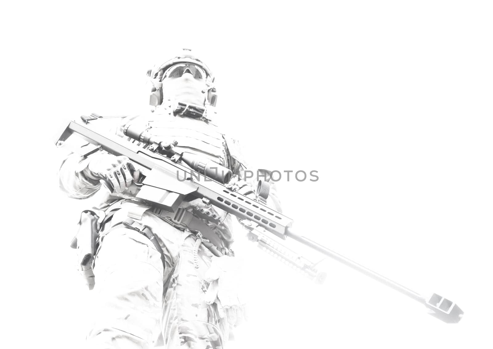 Army sniper of special forces in action posing with large caliber rifle. Low angle view, high key. Standing tall, with their weapon at the ready, skill and confidence of a marksman. Respect for the difficult and dangerous work soldier do.
