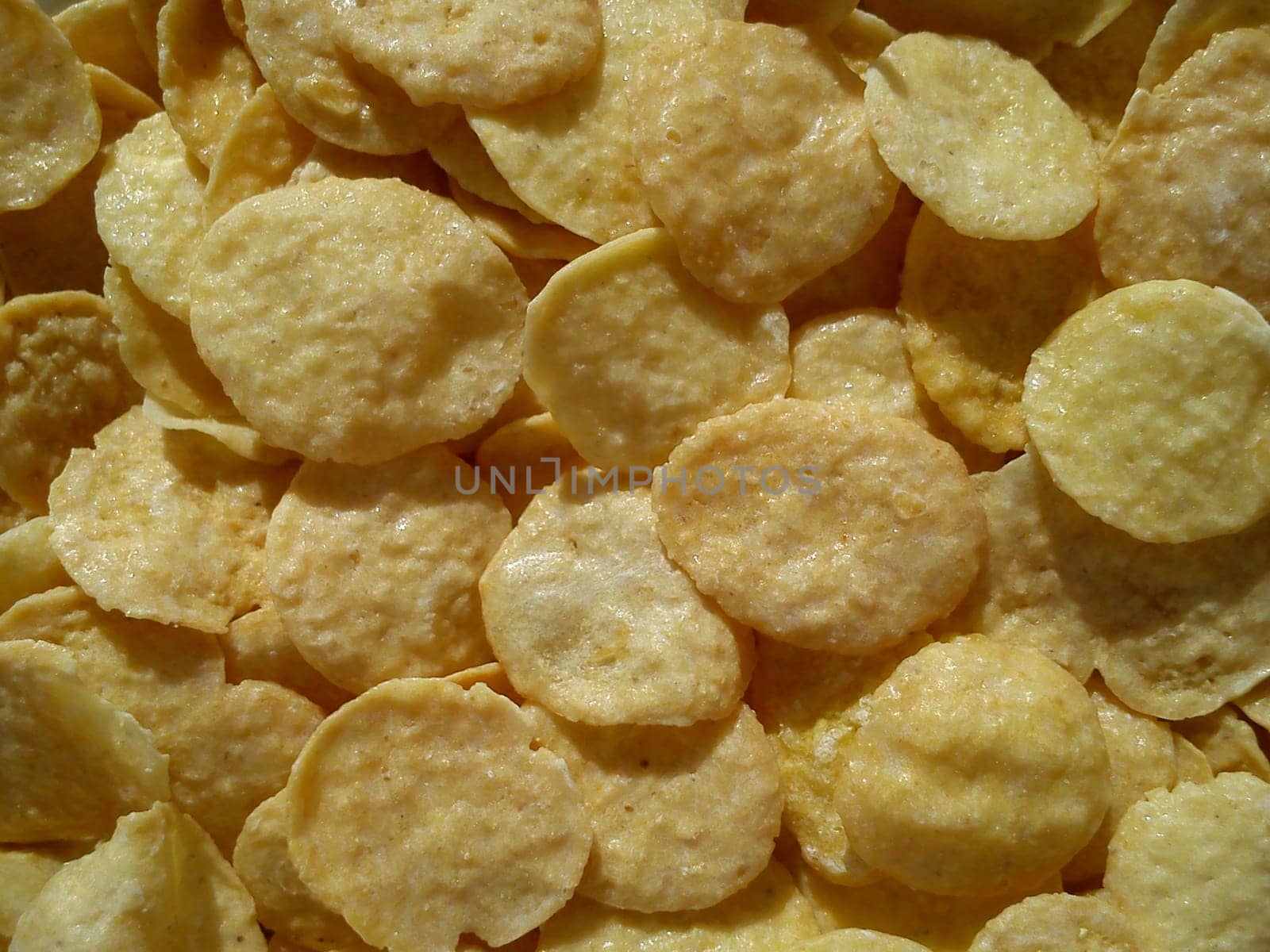 Cornflakes Close up. Yellow flattened flakes. Diet food.