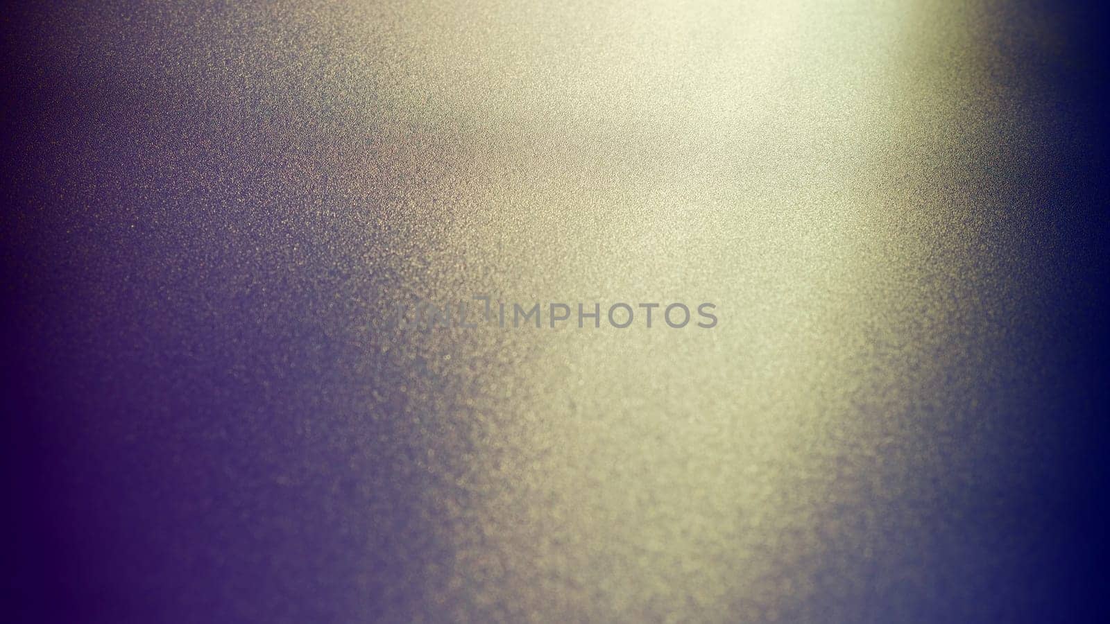 Oblique rays of light on a dark background. Blurred abstract backdrop with light effect and leaks. Side surface illumination. Divergent and asymmetric lines, stripes of light at angle. Yellowish glow.