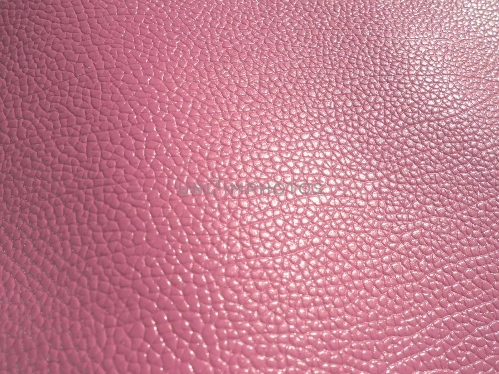 pink leather. Material for fashion accessories, for sewing leather and suede products, furniture upholstery. Natural leather texture.