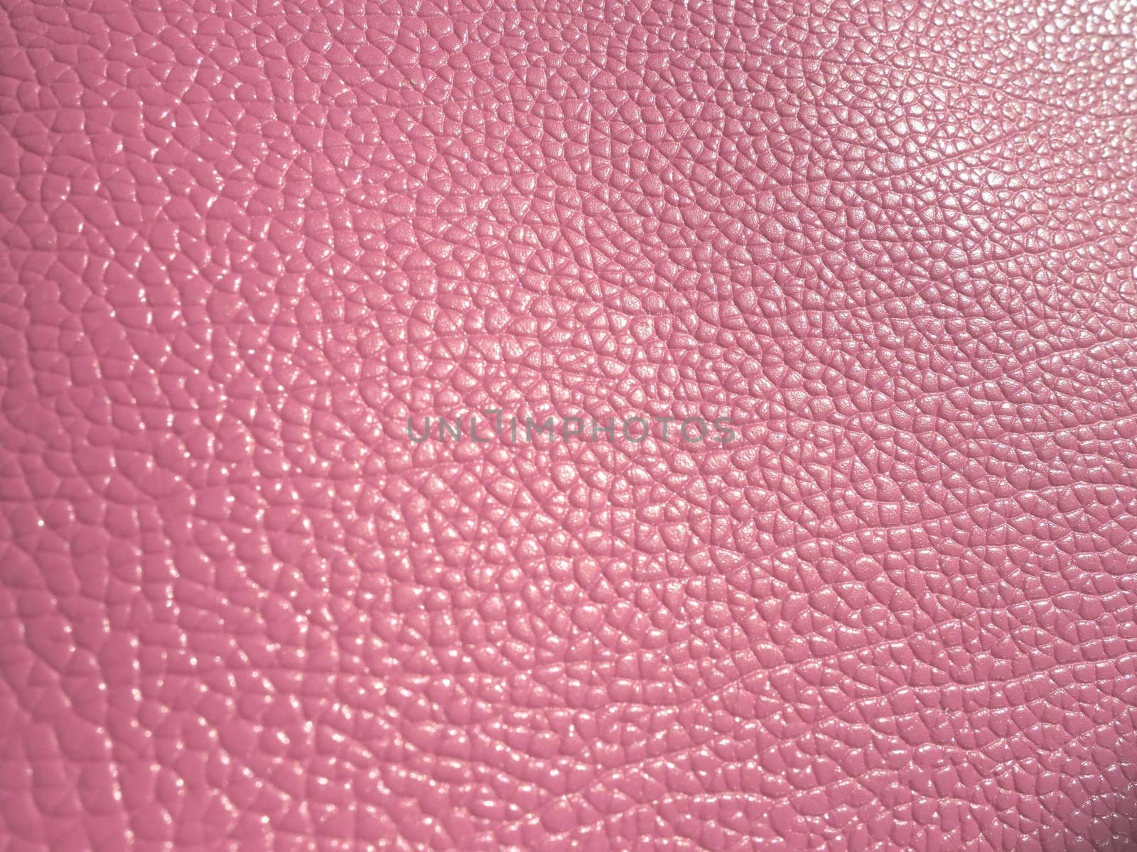 pink leather. Material for fashion accessories, for sewing leather and suede products, furniture upholstery. Natural leather texture.