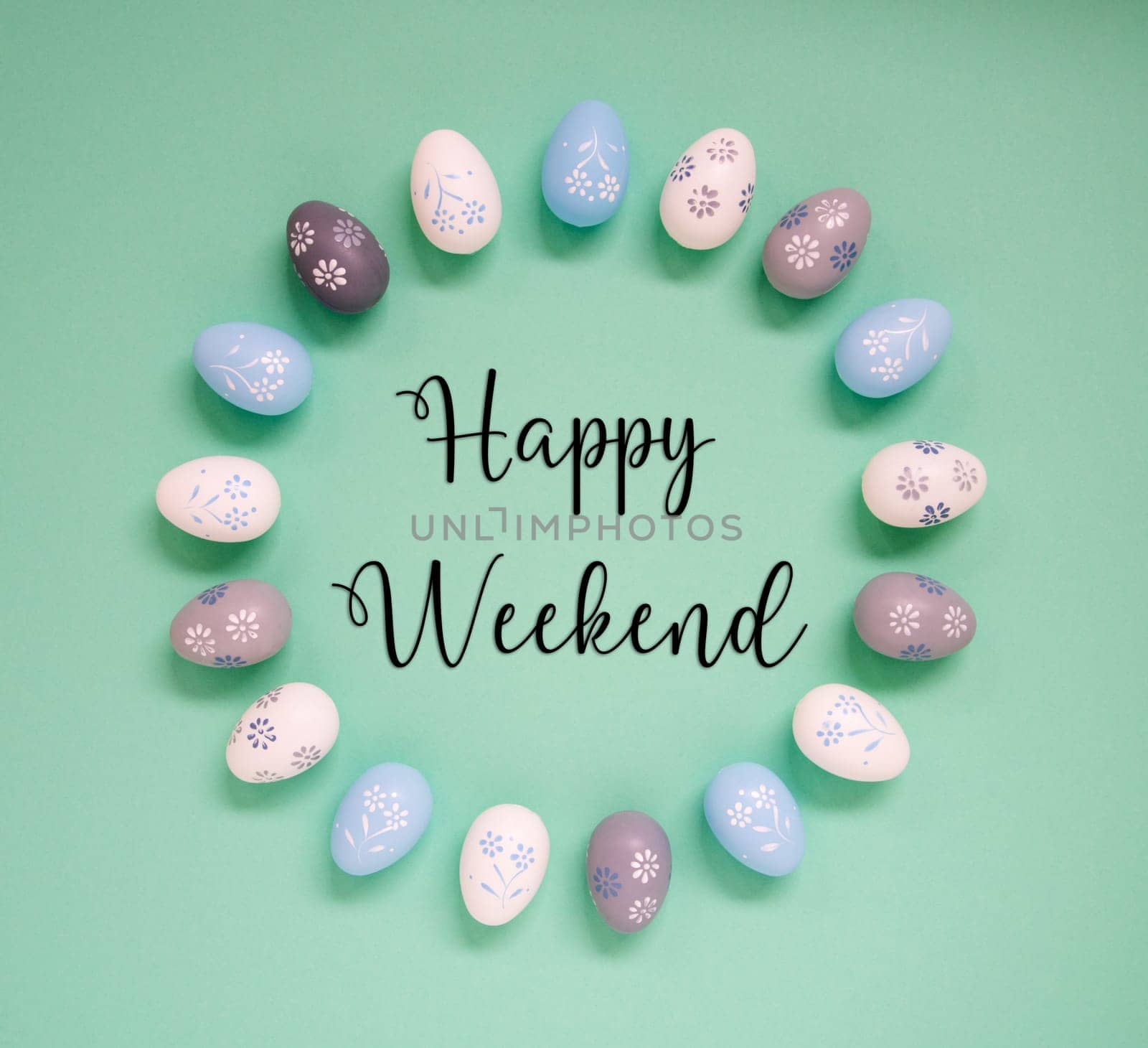 Flat Lay With English Text Happy Weekend. Easter Egg Arrangement, Decoration And Ornament. Light Green Paper Background