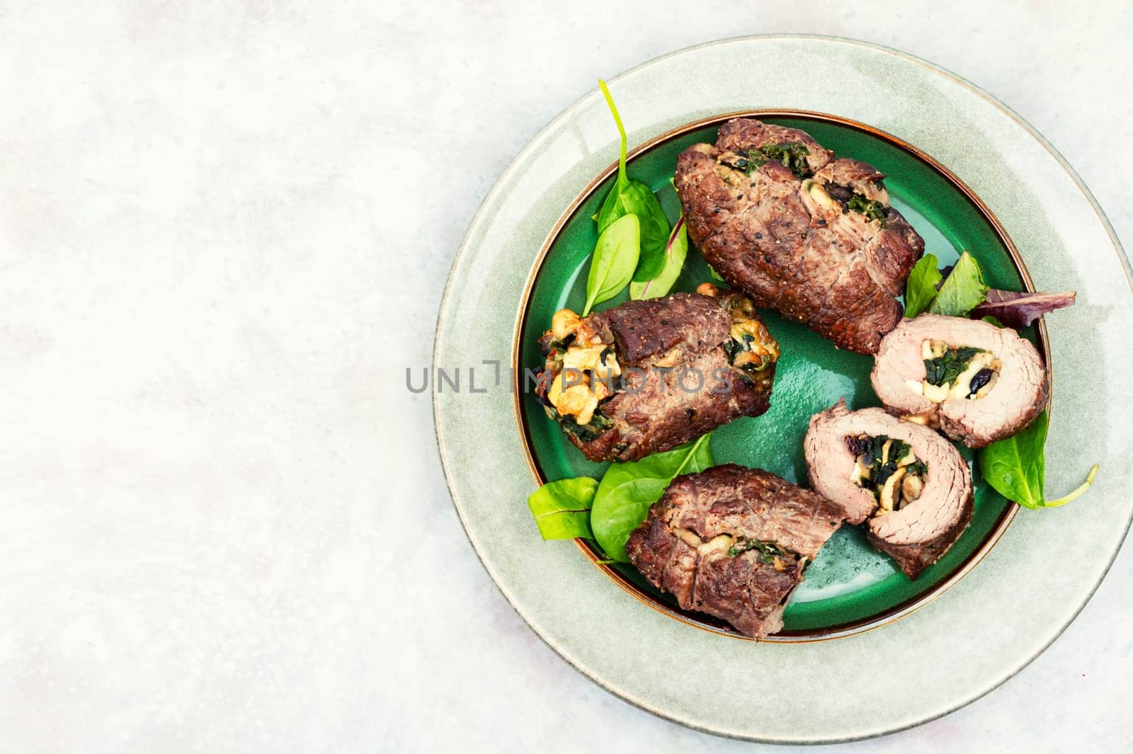 Beef meat rolls stuffed with mushrooms. Top view. Copy space