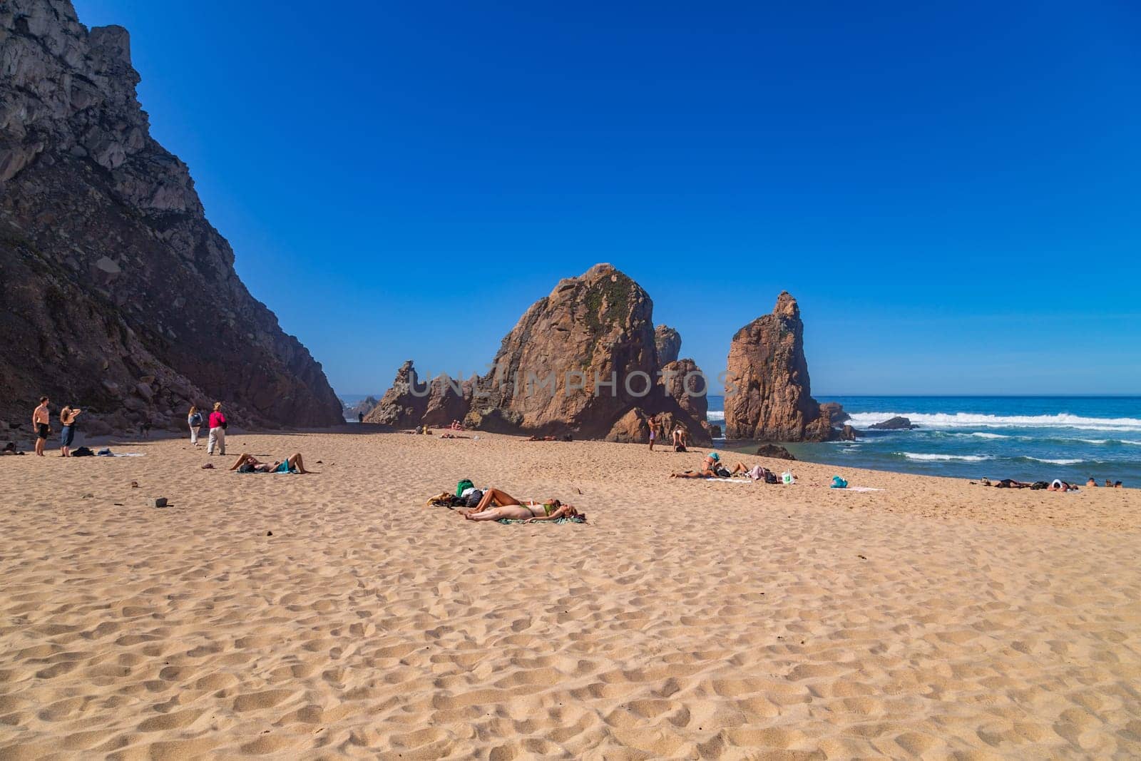 Sintra, Portugal: 22 October 2022 - Praia da Ursa (Ursa Beach) with people, in Sintra near Lisbon in Portugal.