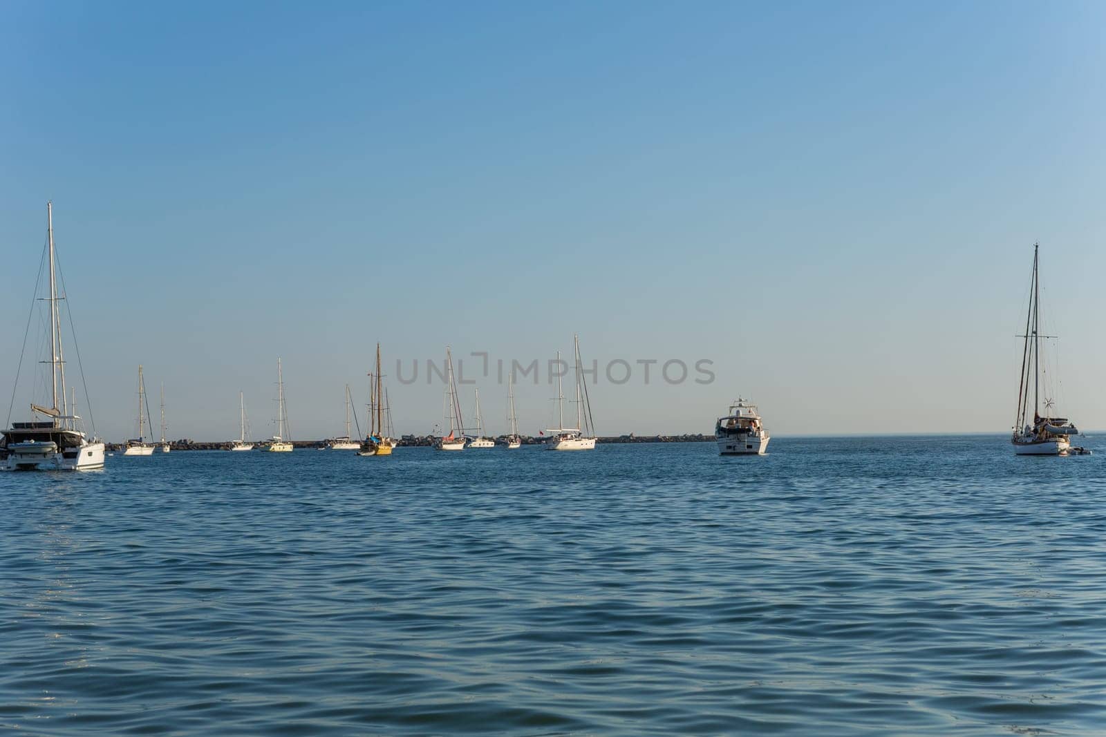 Ferragudo, Portugal - 25 August 2025: Port at the beach, Praia Grande beach. Ferragudo, Lagoa, Algarve, Portugal