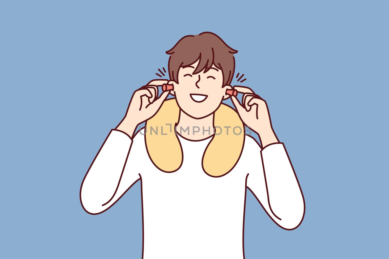 Happy man uses earplugs and neck pillow to rest during long journey on bus or plane. Positive guy traveler is in good mood after getting enough sleep on train