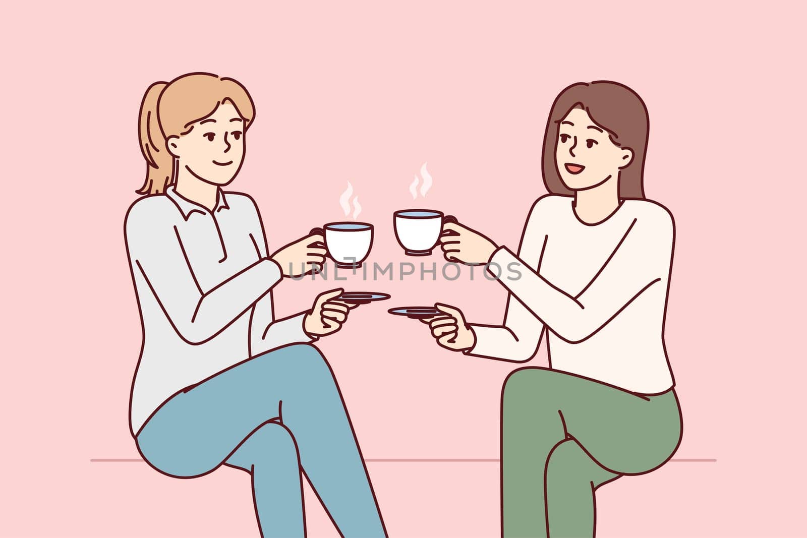 Two beauty girl friends drink hot coffee holding cups and saucers enjoy joint coffeebreak. Ladies dressed in casual style gossip during lunch break with hot non-drinks in hands