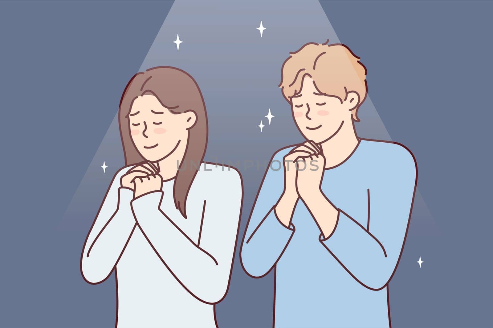Positive man and woman praying asking god for happy marriage. Young couple stand with eyes closed and clasping palms in front of chest together performs religious ritual