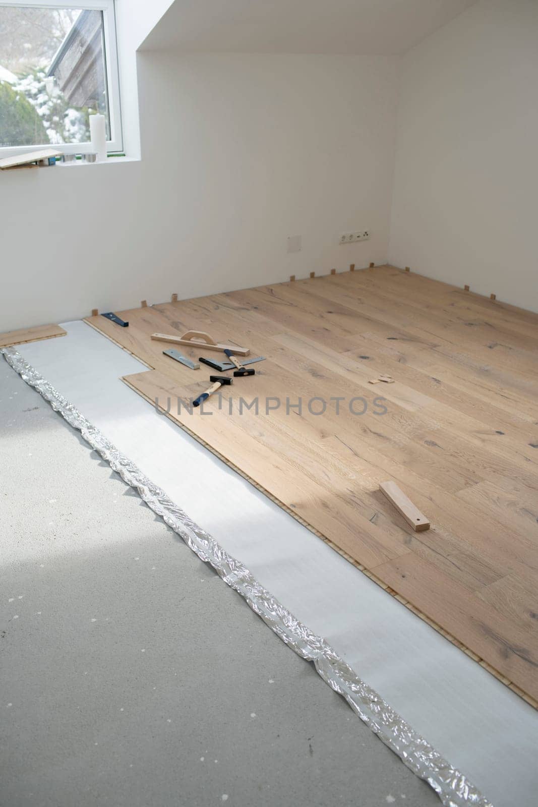 parquet floor laying in a new room, loft, new house