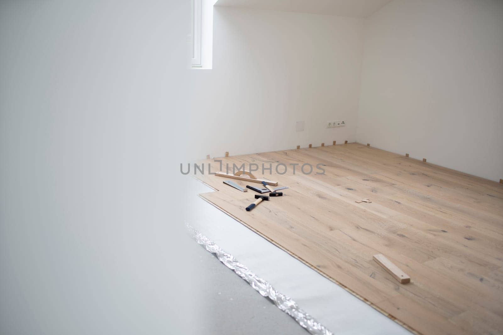 parquet floor laying in a new room, loft, new house