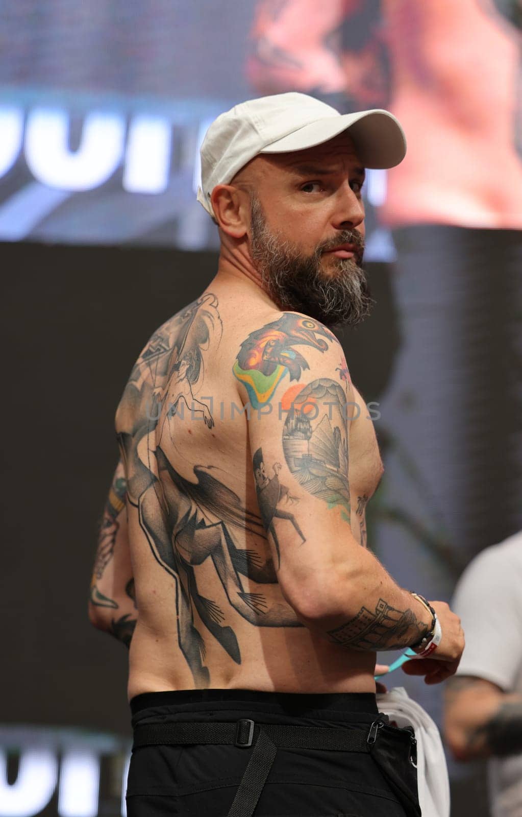 Krakow, Poland - June 11, 2022: Unidentified participant during the contest for the best tattoo at the 15th Tattoofest Convention in Cracow. One of the most prestigious tattoo festivals.