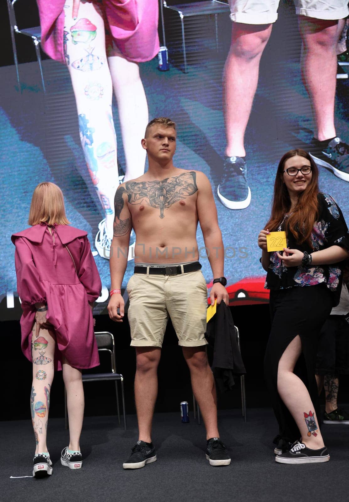 Krakow, Poland - June 11, 2022: Unidentified participant during the contest for the best tattoo at the 15th Tattoofest Convention in Cracow. One of the most prestigious tattoo festivals.