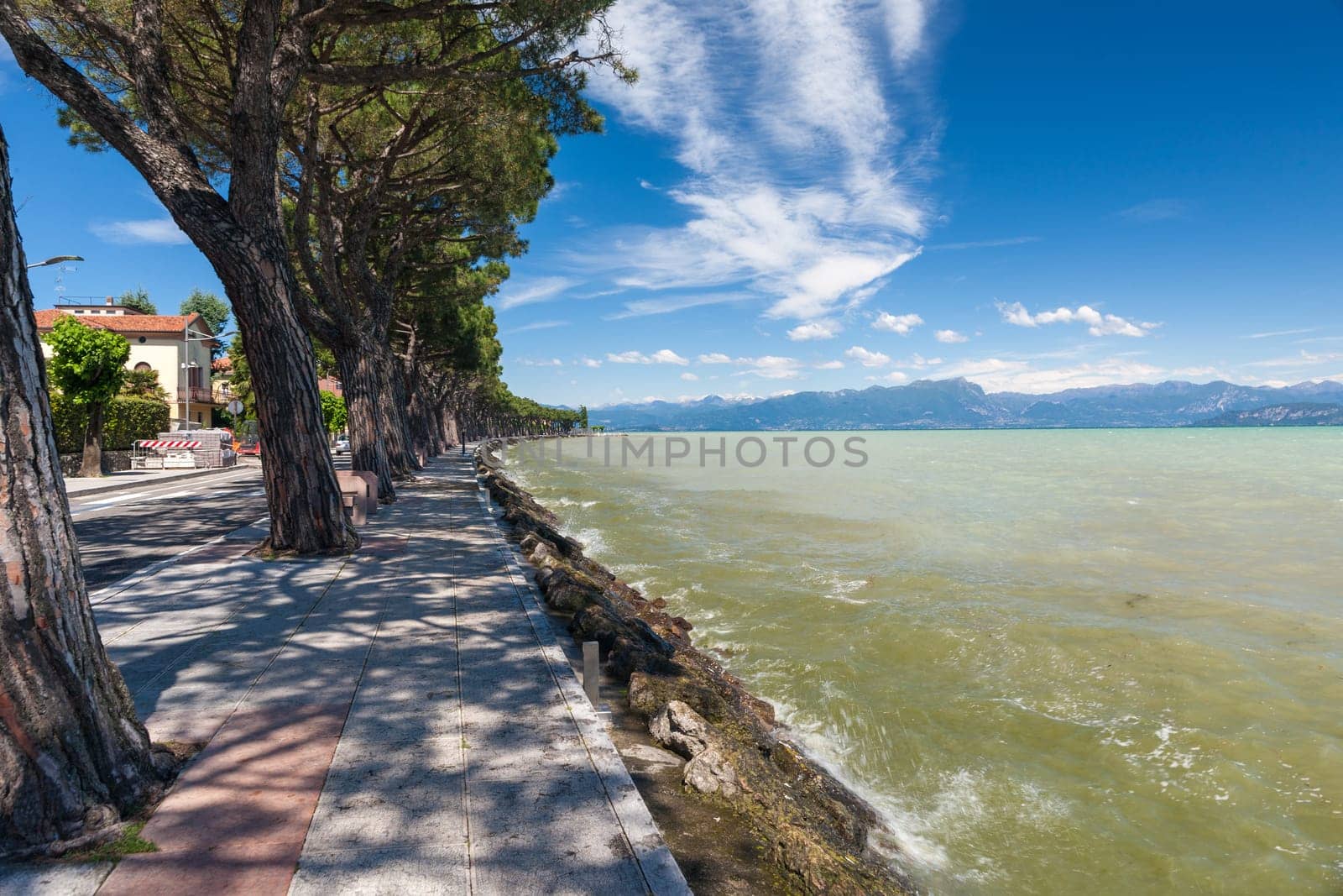 Pedestrian alley on the banks of Garda lake, Italy