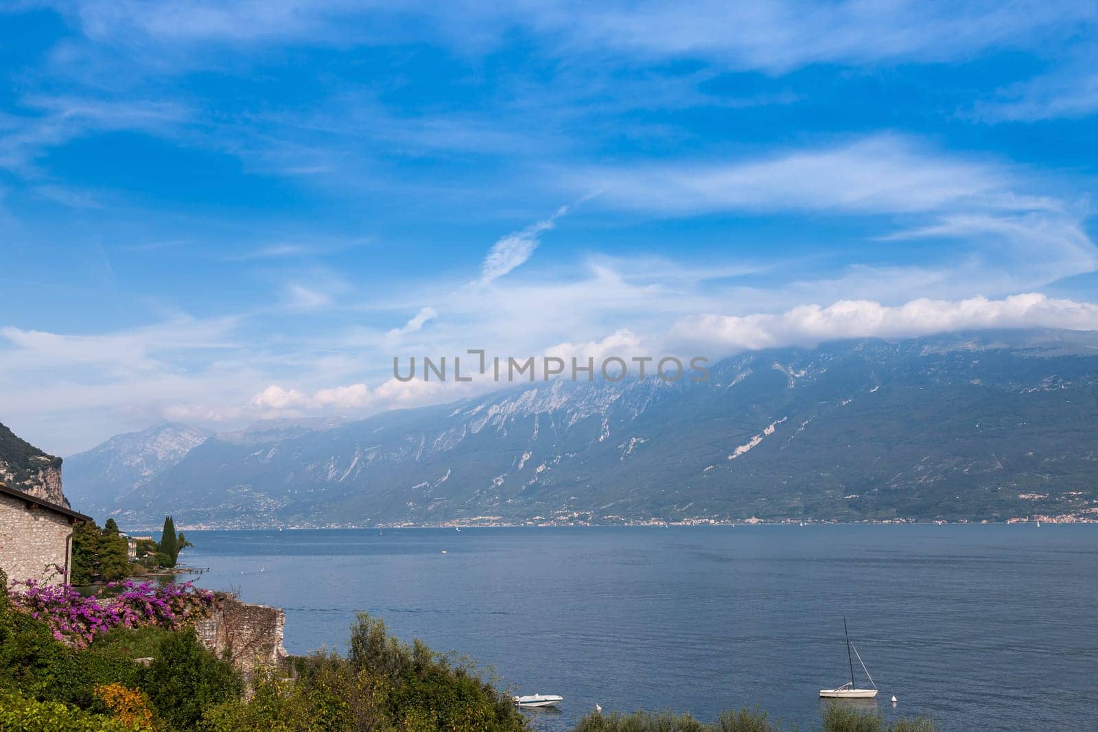 Lake Garda is the largest lake in Italy. It is located in Northern Italy, about half-way between Brescia and Verona, and between Venice and Milan.