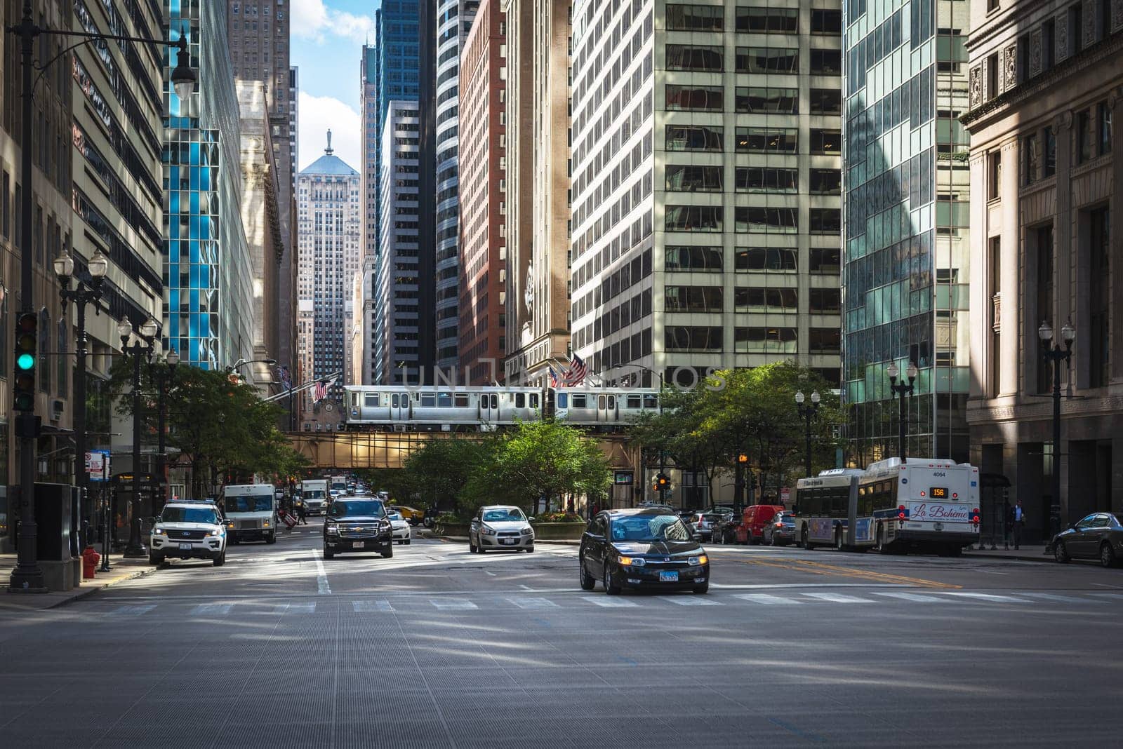 Chicago, Illinois, United States of America : October 11, 2018, Train on elevated tracks within buildings at the Loop, Glass and Steel bridge between buildings - Chicago City Center - Chicago, Illinois, USA