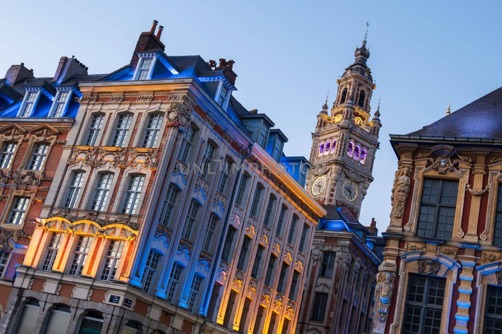 Antique renaissance buildings and the belfry of the Chamber of Commerce in Lille, France