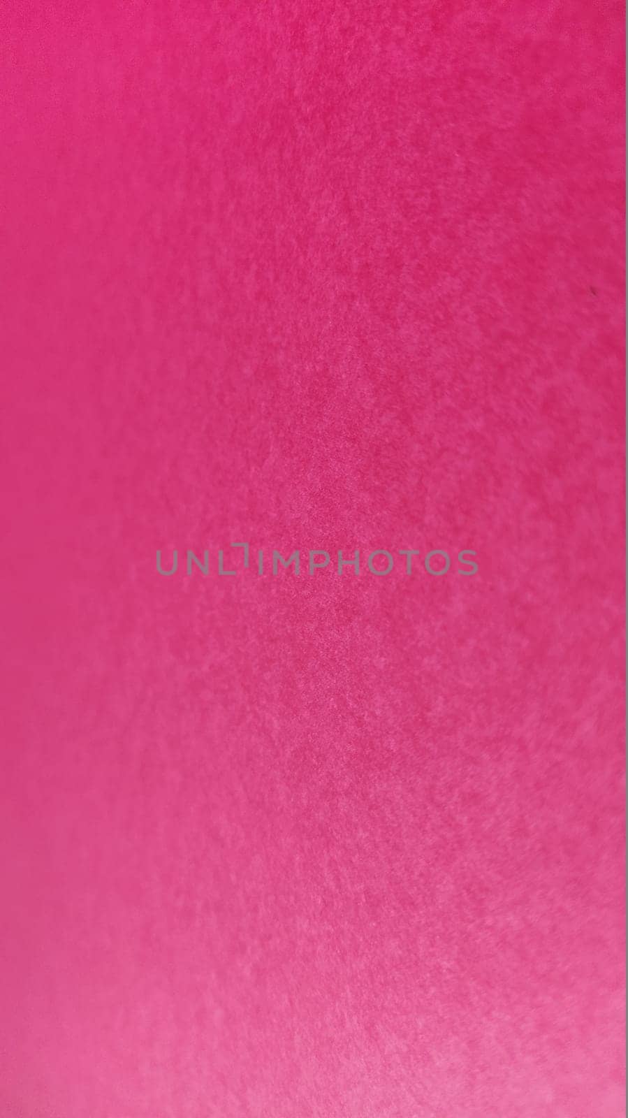Beautiful pink or fuchsia bright background. Scarlet, purple, uneven color. A sheet of colored paper with a soft fleecy texture.