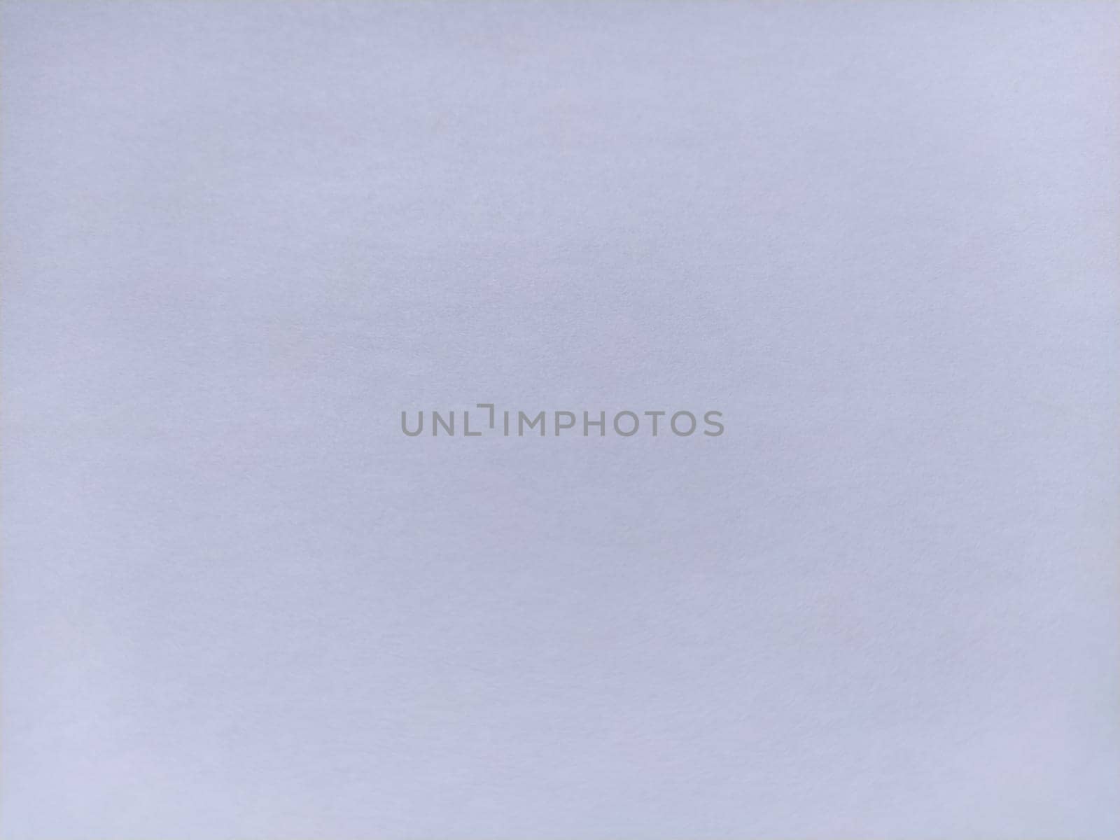 White sheet of paper with pulp texture. Light lilac shade.