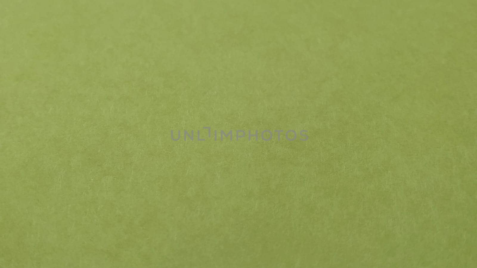 A sheet of light green paper. Calm green with fine paper texture. Soothing interior color. Nice fleecy surface. Copy space.