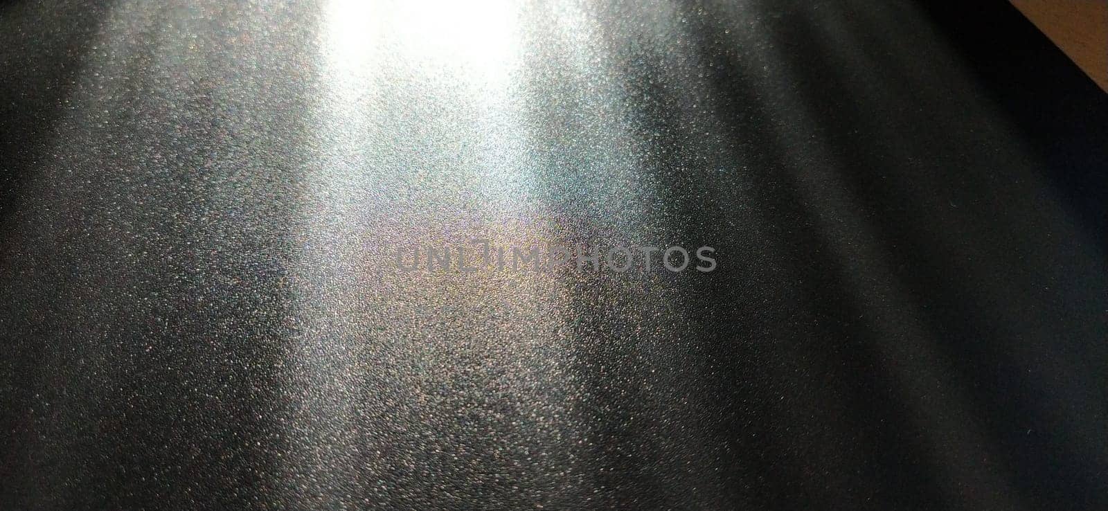 Light beam on black background with sparkles, radiance and sparkles. Festive background. Divine or moonlight effect. Rays falling from top to bottom. The spotlight is shining.
