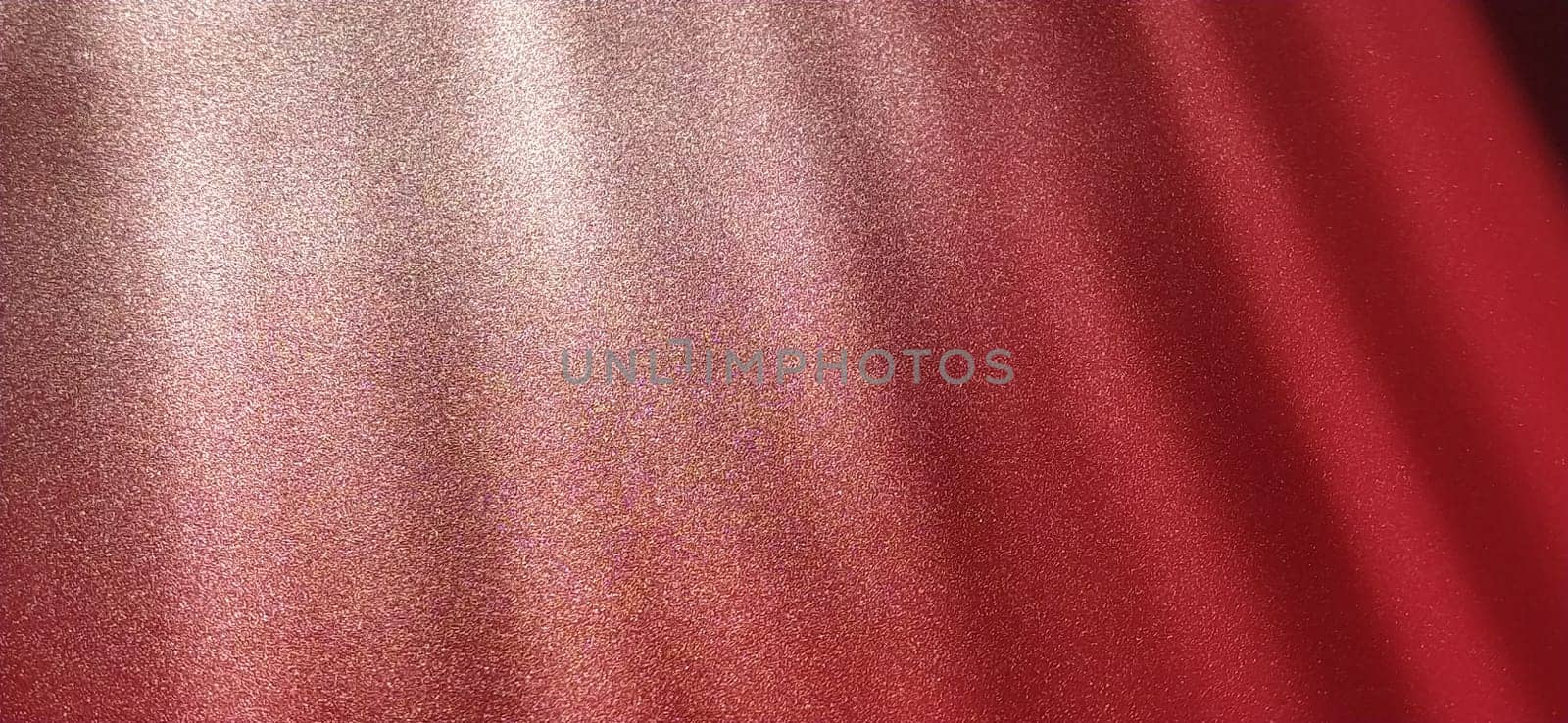blurred striped red background. Play of light and shadow. Light rays. Divine or heavenly radiance from above. Simulate lighting something from above with spotlights. Copy space