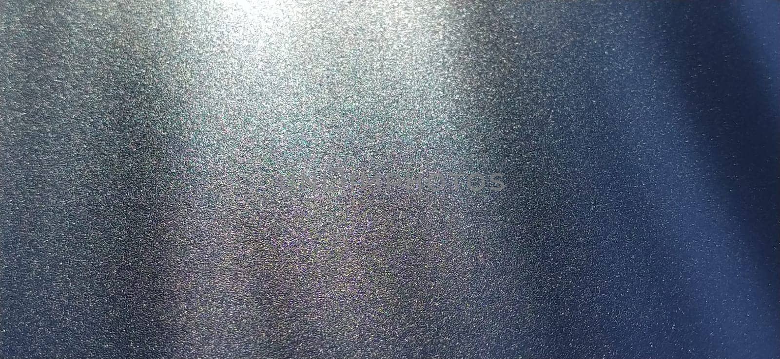 blurred striped dark black and blue background. Play of light and shadow. Light rays. Divine or heavenly radiance from above. Simulate lighting something from above with spotlights. Copy space.