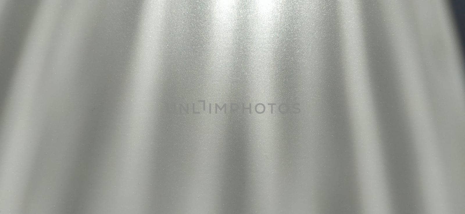 blurred striped gray background. Play of light and shadow. Light beams. Gray and silver shades with white dots and shining stars. Divine or heavenly glow from above.