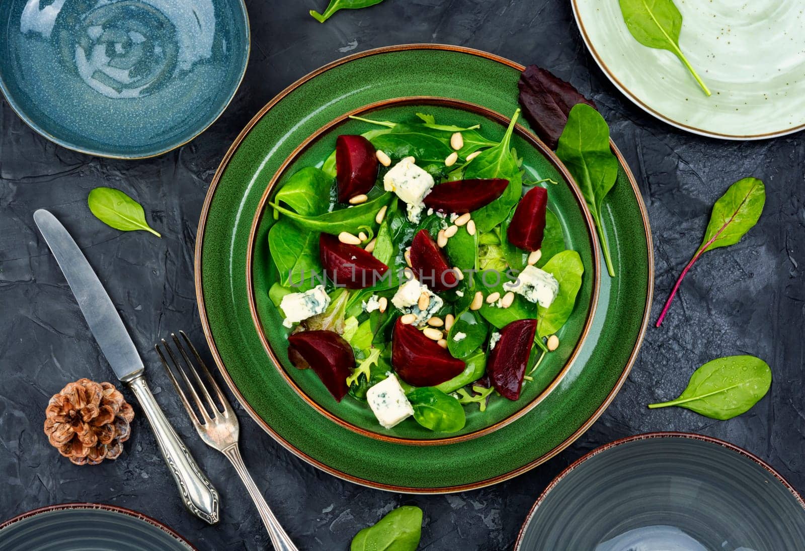 Tasty salad with beets, blue cheese, herbs and pine nuts.