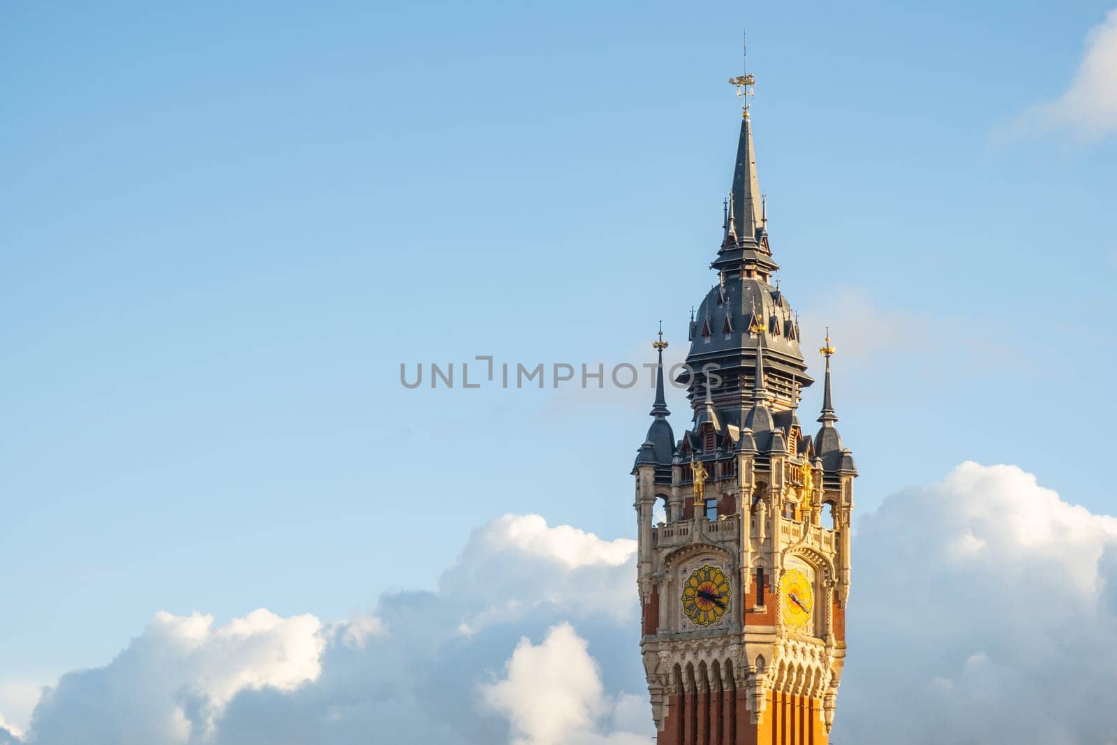Calais, France - january 02 2023 : The belfry of the town hall, city of Calais, Pas-de-Calais, France