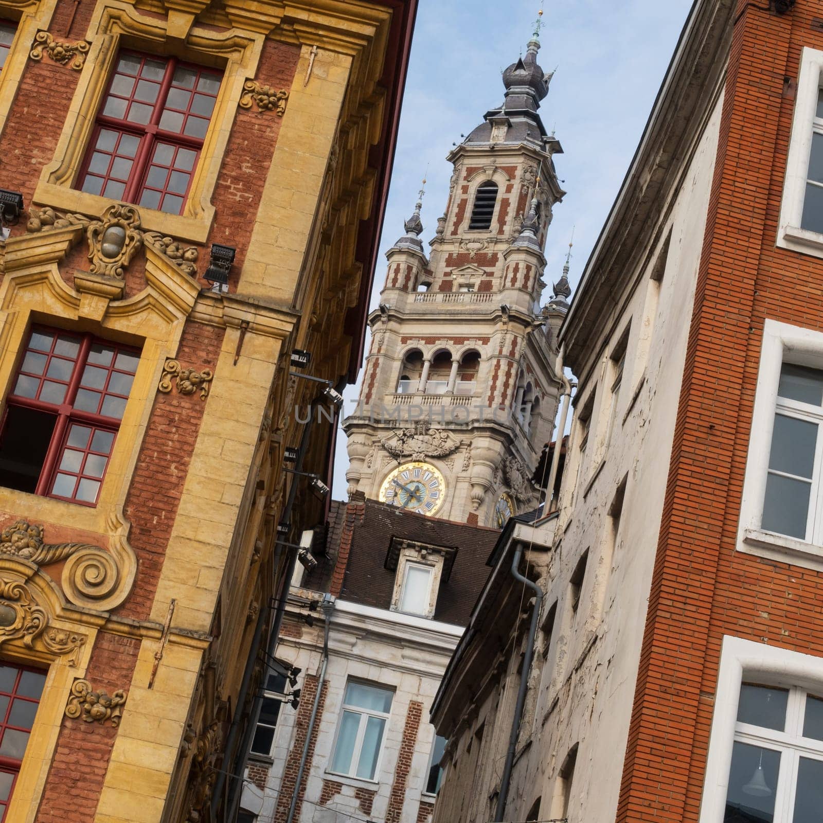 Antique renaissance buildings and the belfry of the Chamber of Commerce in Lille, France