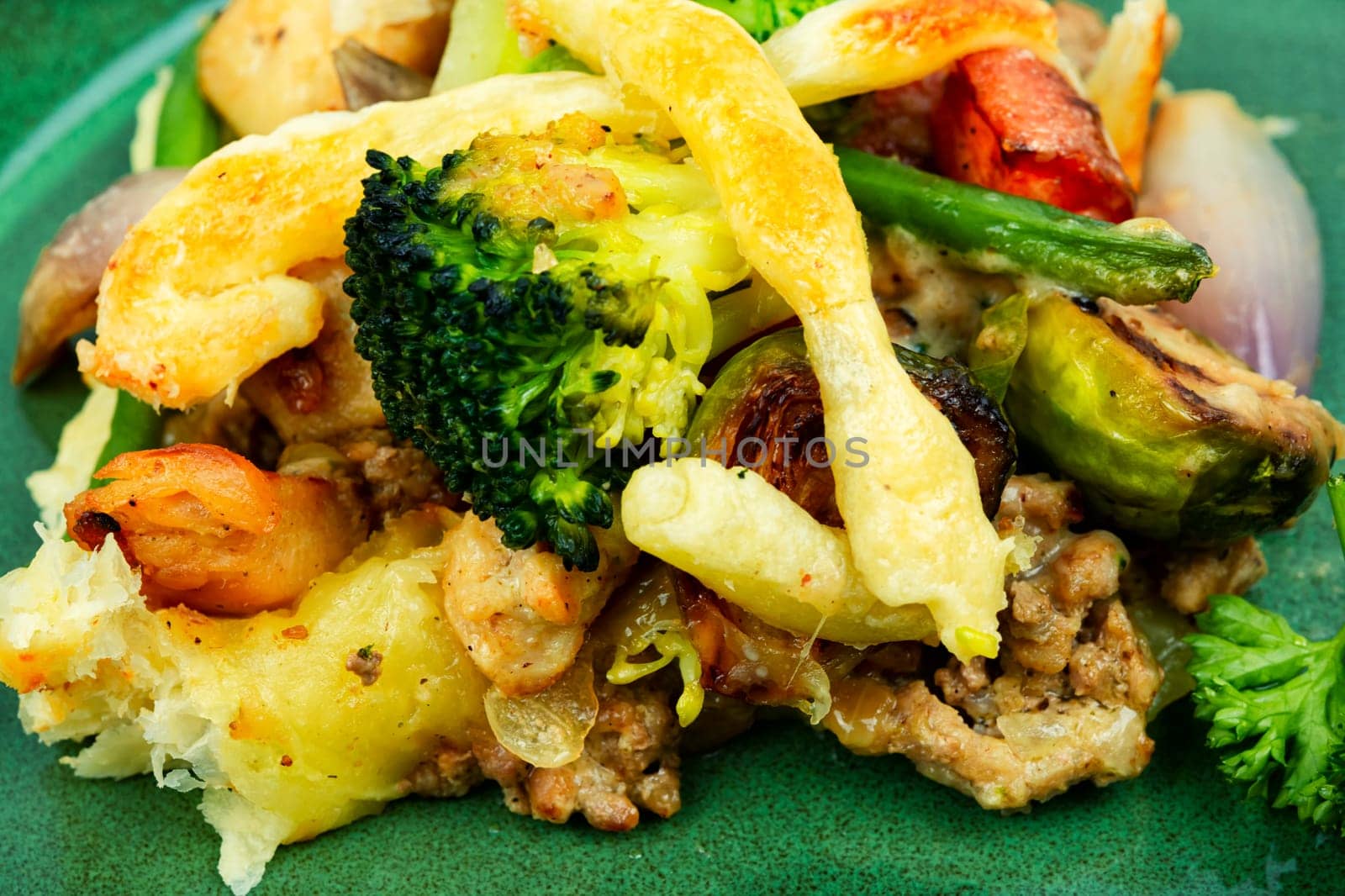Savoury meat pie with brussels sprouts, pumpkin and broccoli. Autumn recipe.