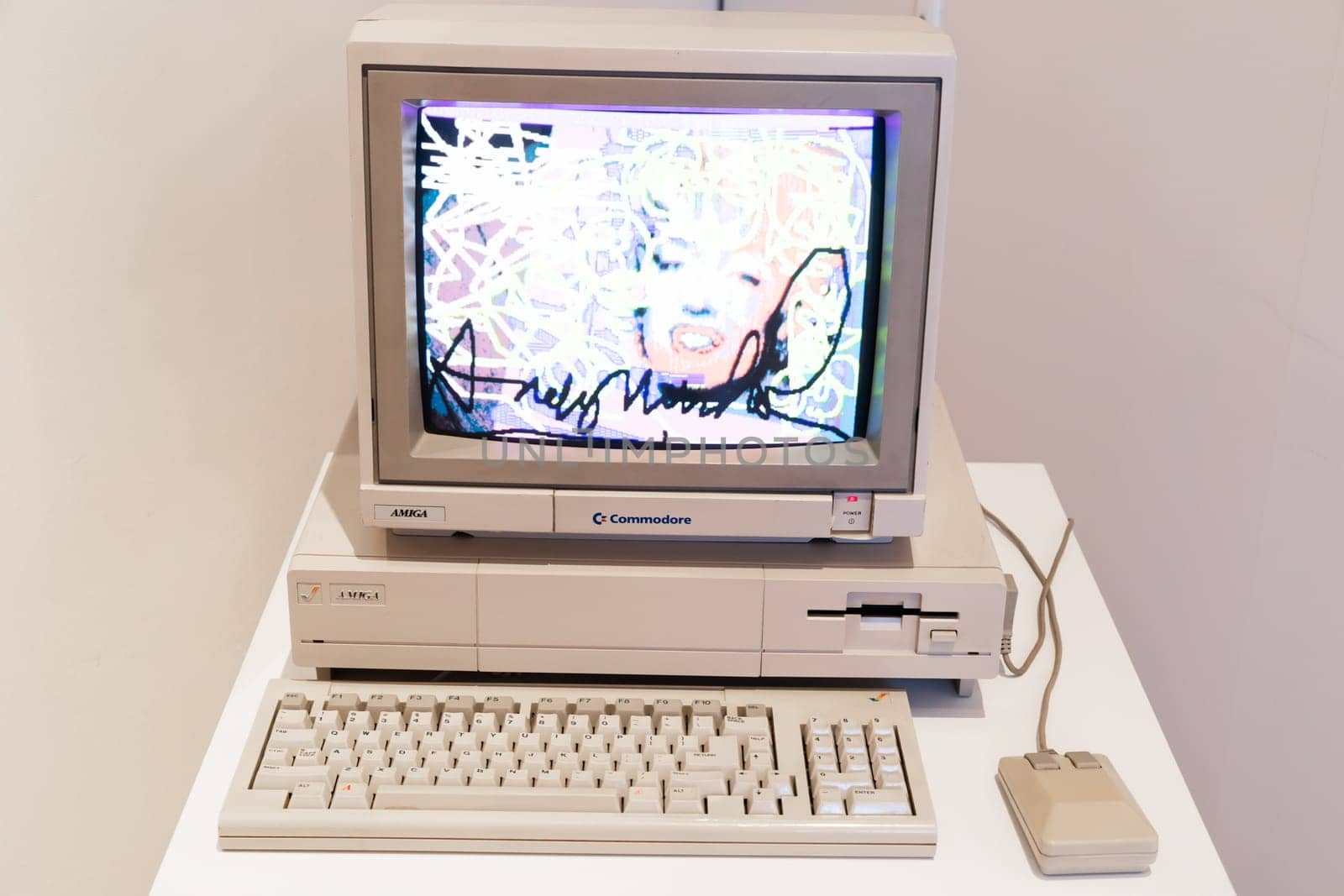 Venaria Reale, Italy - October 2022: Computer Commodore Amiga 1000 with floppy disk, mouse, beige