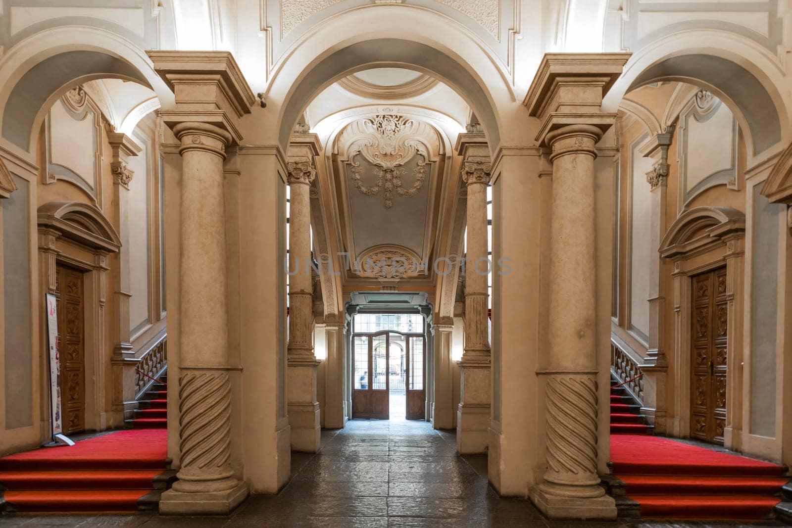 Turin, Italy - January 2023: Palazzo Barolo staircase. Luxury palace with old baroque interior and red carpet