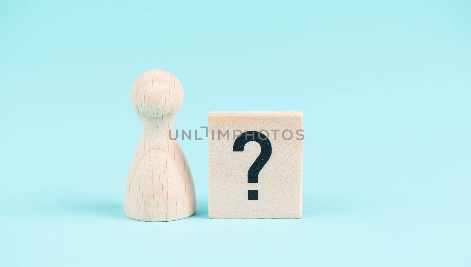 Man with a question mark, education and business concept, searching for answers, thoughts for solving a problem, having doubts